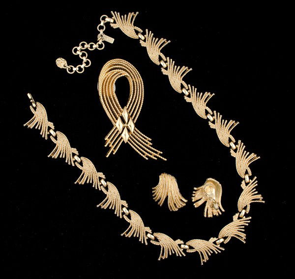 Monet Costume Jewelry Collection : A suite of Monet jewelry that includes a brooch, a pair of wire ear clips and a strand style necklace; all signed pieces are stamped.