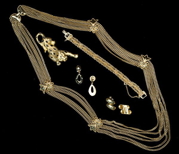 Goldette, Trifari, Napier & Monet Costume Jewelry C: A Goldette triple strand bracelet (with a safety chain), a Trifari brooch, a pair of Napier ear clips, a pair of Monet ear clips and a Monet necklace; all signed pieces are stamped.
