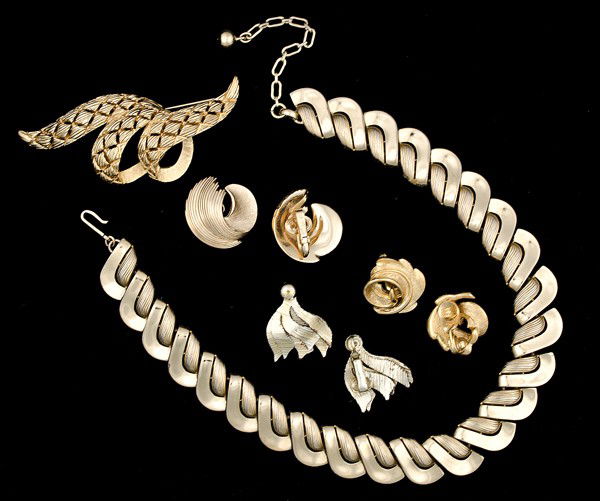 Monet, Tifari & Coro Costume Jewelry Collection : A Monet brooch, a pair of Monet ear clips, a pair of Trifari ear clips, a pair of Coro ear clips and a Trifari collar style necklace; all signed pieces are stamped.