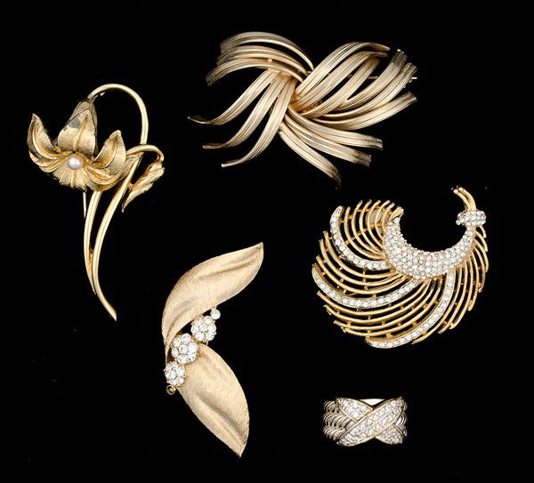 Trifari, Kramer, Marvella & Unsigned Costume Jewelr: A Trifari brooch, a Kramer Brooch, a Marvella Brooch and an unsigned ring; all signed pieces are stamped.