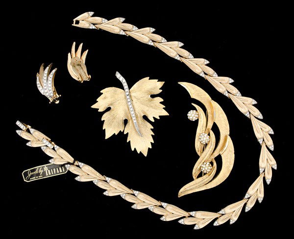 Park Lane, B.S.K, Kramer & Trifari Costume Jewelry: A Park Lane brooch, a B.S.K. brooch, a pair of Kramer ear clips and a Trifari necklace; all signed pieces are stamped.