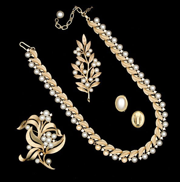 Trifari & Napier Costume Jewelry Collection : Two Trifari brooches with faux pearls, a pair of Napier ear clips with faux pearls and a Trifari necklace with faux pearls; all signed pieces are stamped.