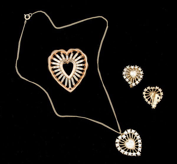 Trifari Costume Jewelry Collection : A Trifari heart brooch, a pair of Trifari ear clips and a Trifari necklace; all signed pieces are stamped.