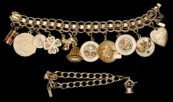 Monet Costume Jewelry Charm Bracelet Collection : A large charm bracelet with multiple sterling charms and a smaller charm bracelet with only a single charm; all signed pieces are stamped.