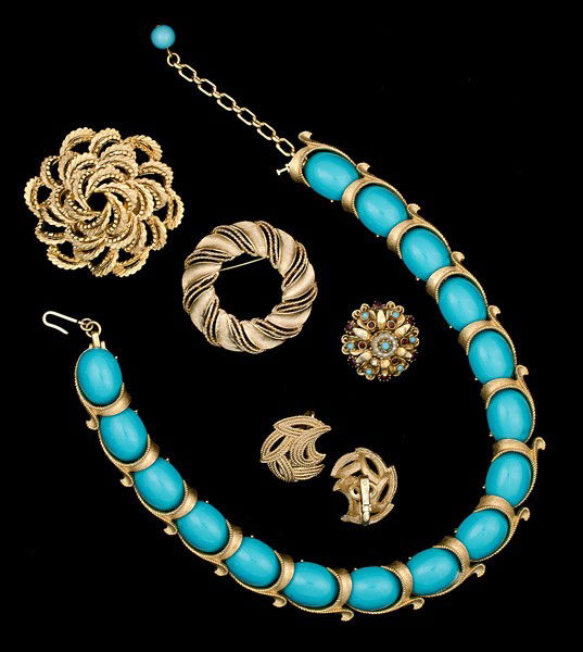 Trifari, Coro & Florenza Costume Jewelry Collection: A Trifari brooch, a Coro brooch, a Florenza brooch, a pair of Trifari ear clips and a Trifari necklace; all signed pieces are stamped .
