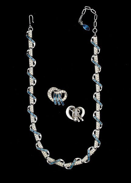 Trifari Costume Jewelry Collection : A pair of Trifari ear clips with faux sapphires and rhinestones with a matching Trifari necklace to complete the set; all signed pieces are stamped.