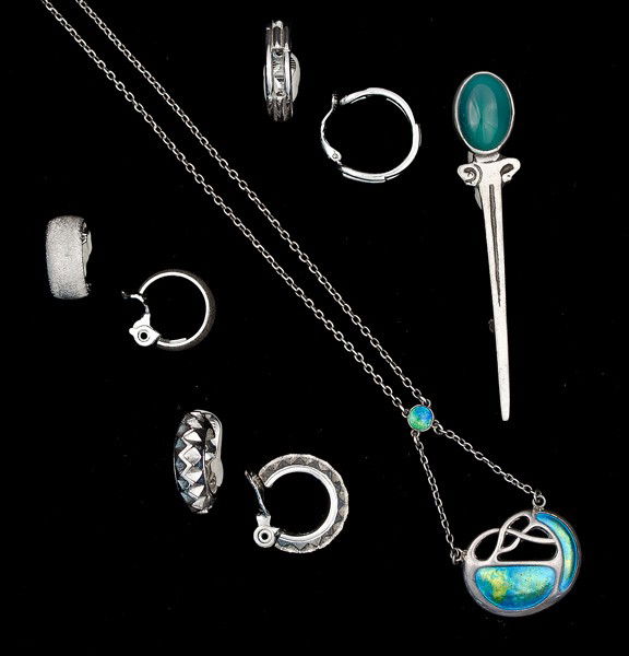 Monet, Trifari & Unsigned Costume Jewelry Collecti: An unsigned sterling brooch, two pairs of Monet ear clips, a pair of Trifari ear clips and an unsigned Celtic style necklace; all signed pieces are stamped.