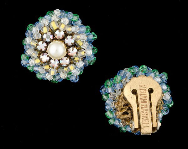 Miriam Haskell Earclips : A pair of Miriam Haskell beaded earclips with rhinestone and faux pearl center; all signed pieces are stamped.