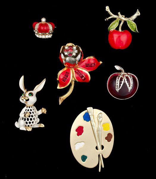Sarah Coventry, Gerry, Ciner, Coro & Trifari Ename: A Sarah Coventry brooch, a Gerry brooch, a Ciner enameled crown brooch, a Trifari brooch, a Coro Flower brooch (Patent No. 117802), an illegible paint canvas brooch; all signed pieces are stamped and