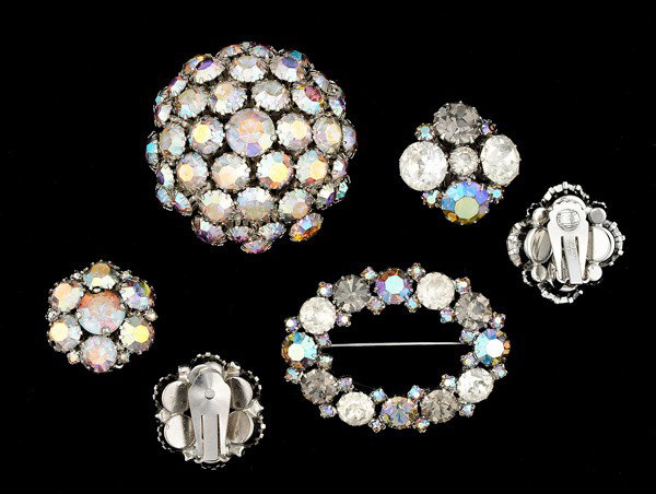 Karu & Warner Costume Jewelry Collection : A pair of Karu ear clips with a matching brooch and a pair of Warner ear clips with a matching brooch; all signed pieces are stamped.