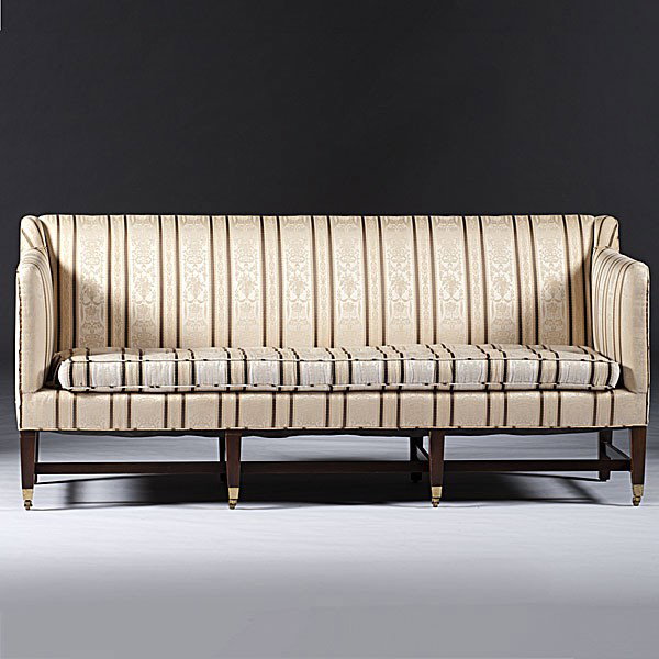 Hepplewhite-style Sofa : Hepplewhite-style Sofa American, 20th century, a Hepplewhite-style sofa having a long loose cushion, eight square tapering legs connected by stretchers and ending in brass casters; ht. 33, wd. 74, d