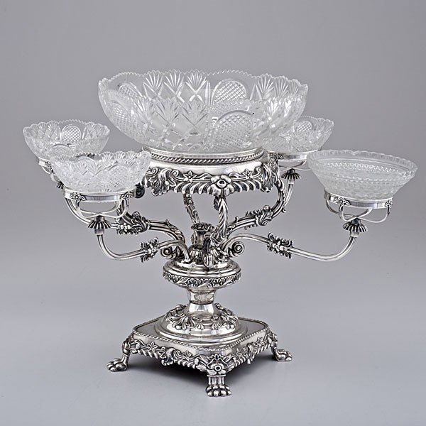 Sheffield Epergne : Sheffield Epergne English, ca 1880s, an unmarked silver on copper Sheffield plate four-armed epergne, supporting cut glass bowls, on base with paw feet; ht. 15.25 in. Provenance: Property of Caswe