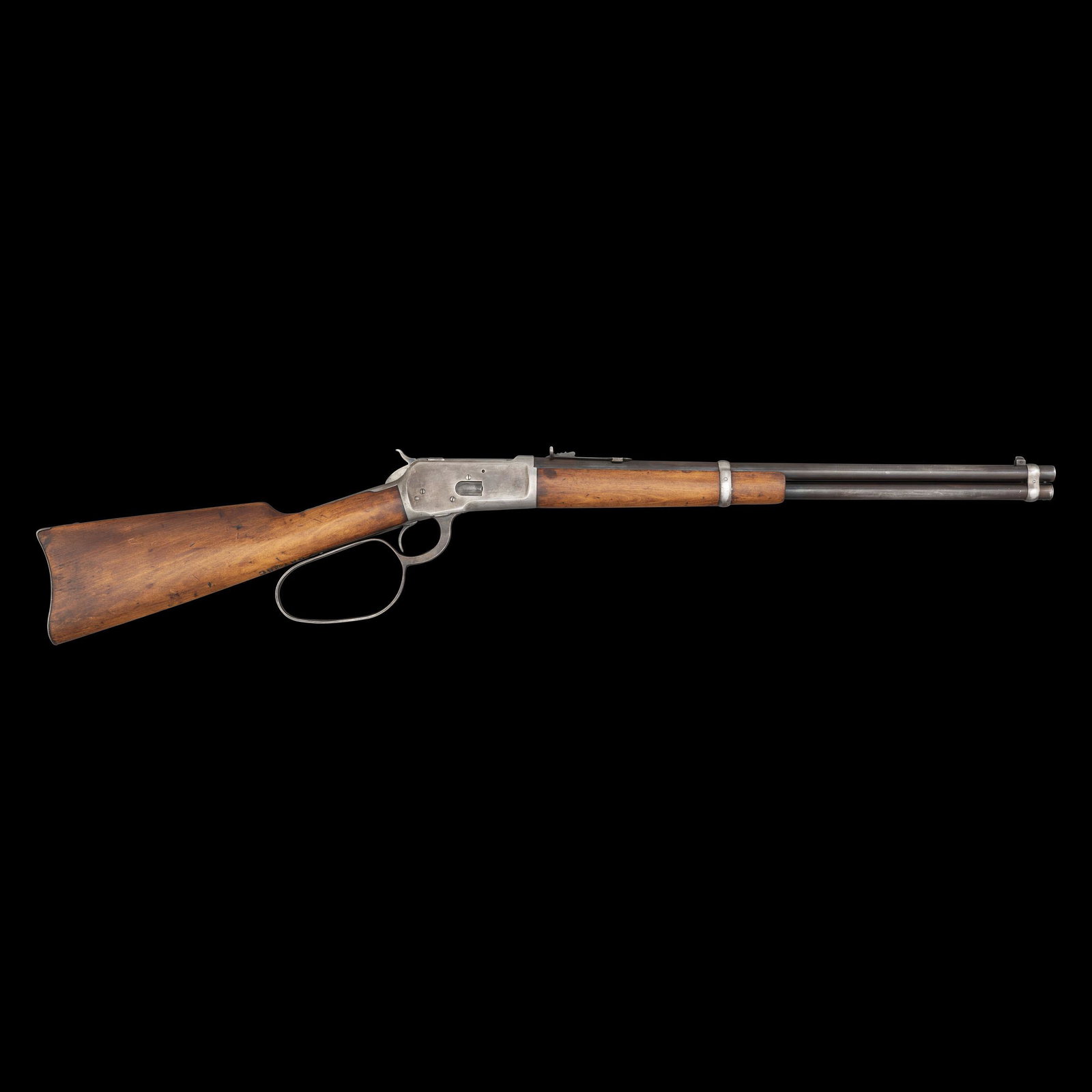 ** From John Wayne's BATJAC Production Company A Winchester Model 1892 Large Loop Saddle Ring: .44-40 WCF. 20" barrel length. SN: 987062 (Mfg. ca.1927). Blued metal finish. Walnut stock has a plain straight grip and forearm. Lever action rifle with cowboy-style large loop lever, adjustable se