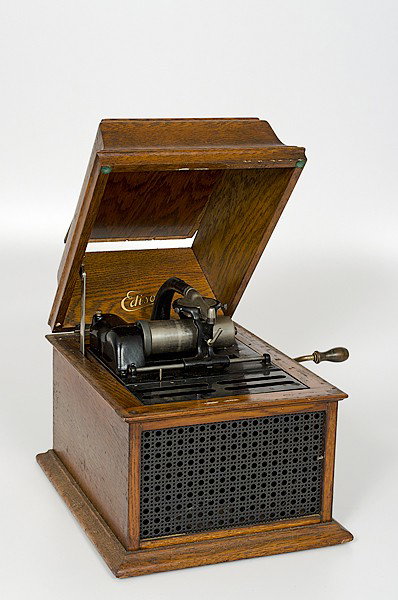 Edison Victrola : Edison Victrola American. A Victrola in an oak case with hinged lid marked Thomas Edison Trade Mark; with an accompanying box of cylinders; ht. 12.5, wd. 15, dp. 11.75 in.