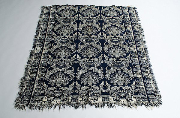 Coverlets and Shawls : Coverlets and Shawls American, three unsigned coverlets including one coverlet in blue and white with peacocks and floral urns surrounded by a town border, one coverlet in four colors with stars and