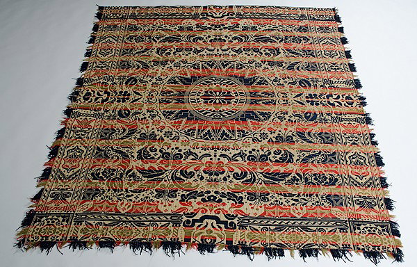 Three Color Coverlet : Three Color Coverlet American, 19th century. A woven coverlet with central medallion surrounded by flowers and geometric designs all in red, green, and blue, with corner blocks unsigned; 79 x 85 in.