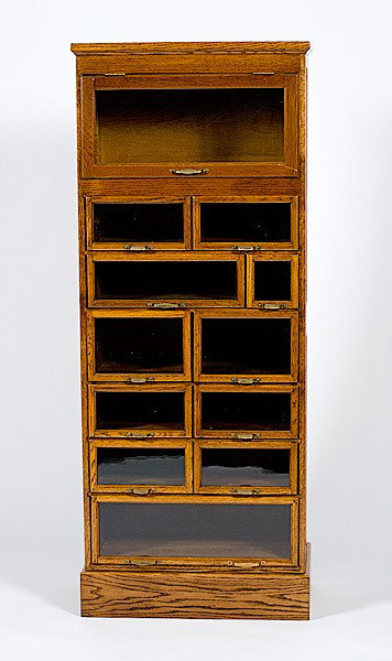 Warren Pharmaceutical Cabinet : Warren Pharmaceutical Cabinet American, early 20th century. A pharmaceutical cabinet made by Warren in oak with metal cup handles; ht. 66.5, wd. 25.75, dp. 14.75 in.