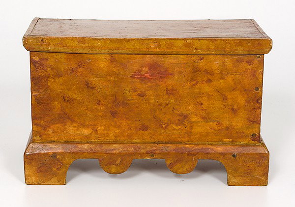 Miniature Painted Blanket Chest : Miniature Painted Blanket Chest American, a miniature painted blanket chest in poplar with nailed construction and leather hinges, having a moulded lid, scroll-cut skirt, and bracket feet, appears t