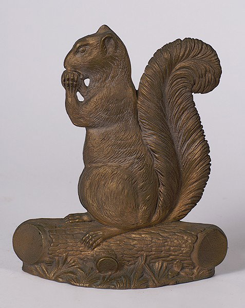 Cast Iron Squirrel Doorstop : Cast Iron Squirrel Doorstop American. A painted cast iron door stop in the style of a squirrel, attributed to Bradley and Hubbard; ht. 11.5 in.