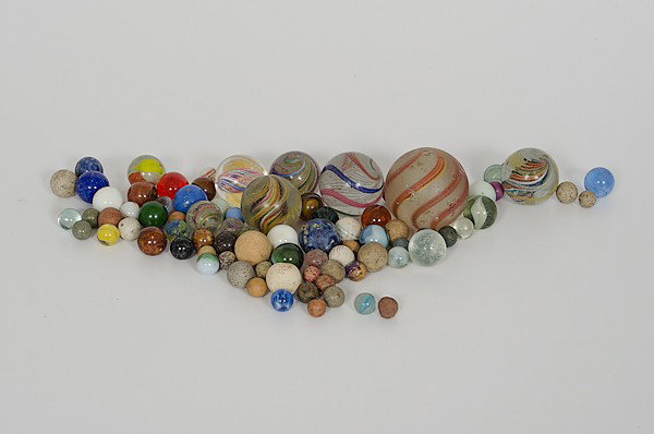 Marbles : Marbles Assortment of early glass marbles, including swirls, agate, cat eye and china marbles.