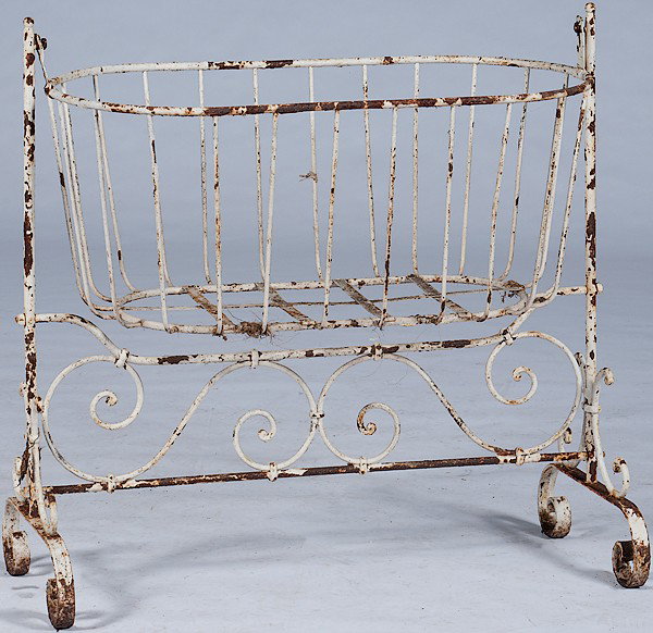 Wrought Iron Cradle Plant Stand : Wrought Iron Cradle Plant Stand American, a wrought iron cradle plant stand on a scrolled trestle base; ht. 37, wd. 38.5, dp. 17.25 in.