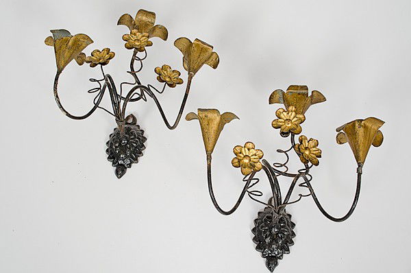 Wrought Iron Three Light Candle Sconces : Wrought Iron Three Light Candle Sconces A pair of cast iron mount candle sconces, each having three twisted wrought iron arms ending in a flower form candle holder, unmarked; ht. 10.75 in.