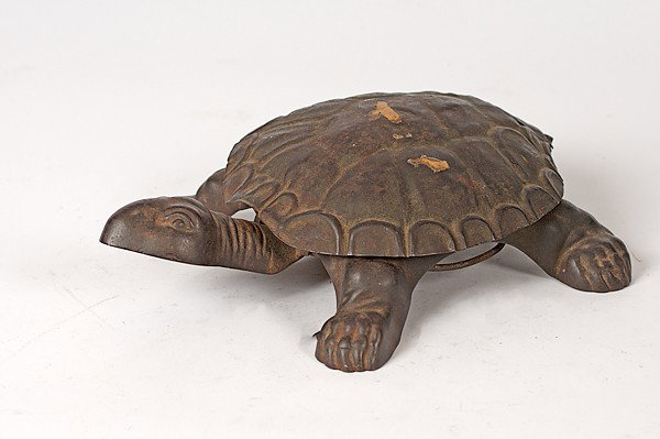 Golden & Jacobson Turtle Spittoon : Golden & Jacobson Turtle Spittoon American, late 19th/early 20th century. A Golden & Jacobson turtle spittoon, when the head is stepped on then the shell flips up to reveal a catch pan, marked Golde