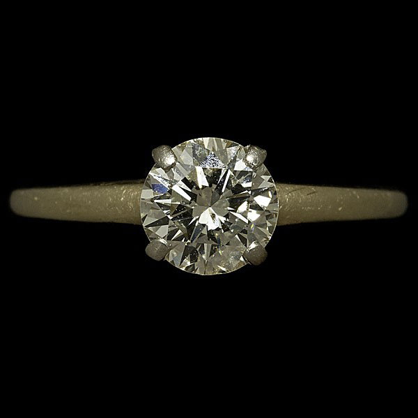 Diamond Solitaire Engagement Ring : Diamond Solitaire Engagement Ring A 14K gold solitaire ring prong set with one round brilliant diamond approximately .94cts, I1-I2 clarity, K color and good cut. Measures ring size 8 and a weight of