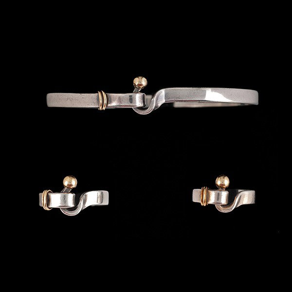 Tiffany Hook and Eye Sterling Set : Tiffany Hook and Eye Sterling Set Tiffany, signed, set of three pieces. Two hook and eye rings, 18k yellow gold and sterling silver and the bracelet is hook and eye bangle style Ring sizes 4 and 7; 