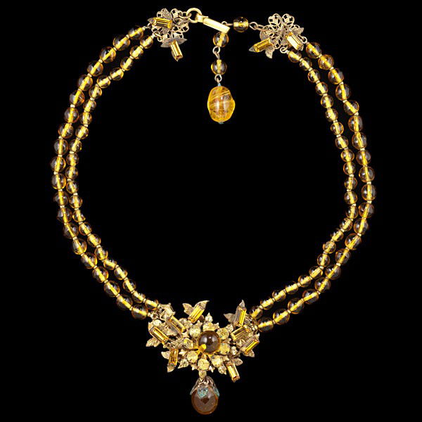 Miriam Haskell Gilt and Amber Color Necklace : Miriam Haskell Gilt and Amber Color Necklace A Miriam Haskell gilt necklace; a mix of amber toned beads and rhinestones with signature clasp. Stamped: Miriam Haskell.