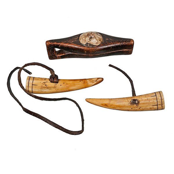 Eskimo Thong Drill Set : Eskimo Thong Drill Set 2 pieces; includes fossilized ivory tusks decorated with incised lines and seal; leather strap threaded through tusk, length 5.5 in.; AND a wooden hand piece with quartz inser