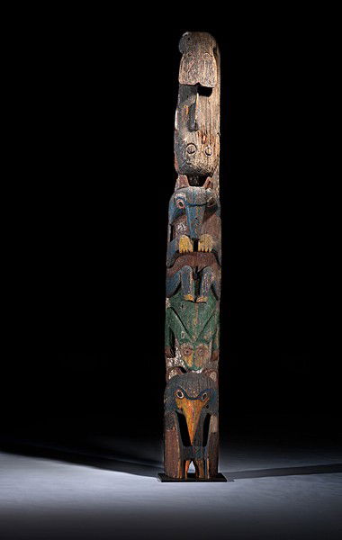 Haida Polychrome Totem Pole : Haida Polychrome Totem Pole Carved of a single piece of wood with concave back; stacked figures painted in deep colors of black, yellow, blue, green, and white include a whale, wolf, frog, and raven