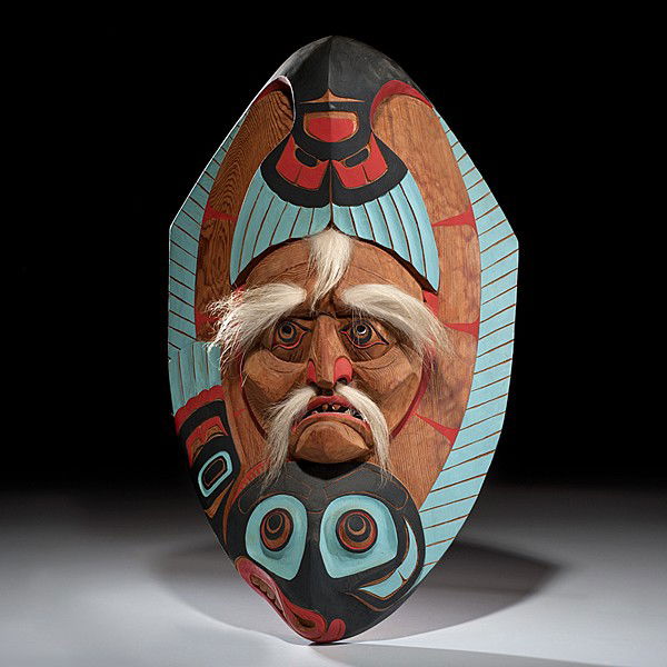 Don Lelooska Kwakiutl Carved Mask Old Man Halibut : Don Lelooska Kwakiutl Carved Mask Old Man Halibut Carved of cedar and painted using red, blue, and black; man's face, detailed with white-tail deer fur, emerges from the back of a halibut; signed on
