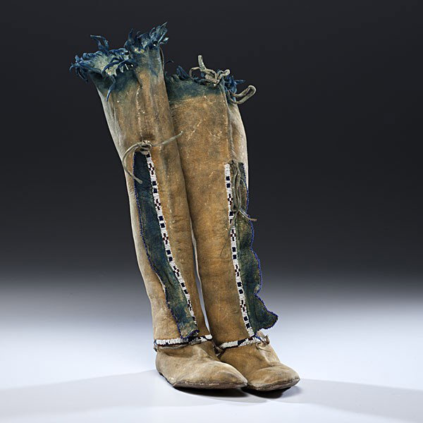 Comanche Beaded Hide Hightop Moccasins : Comanche Beaded Hide Hightop Moccasins Sinew-sewn and beaded using colors of dark blue, rose, and white; cobalt pigment decorates uppers and sides of moccasins, height 17.5 in. x length 8.5 in. four
