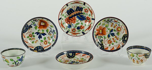 Gaudy Dutch Cups and Berry Bowls : England, early 19th century. Two Gaudy Dutch cups and four berry bowls, all polychrome painted on pearlware bodies, the cups and three bowls in the "Single Rose" pattern and one bowl in the "War Bonne