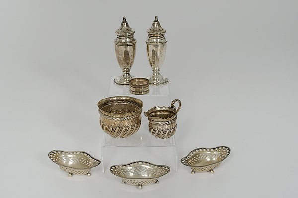 Group of Sterling Tablewares : A assembled group of sterling tablewares, including three open salts with reticulated rims, lg. 4 in.; a pair of sterling casters, ht. 5 in.; a sterling napkin ring; and a sterling cream and sugar, ha