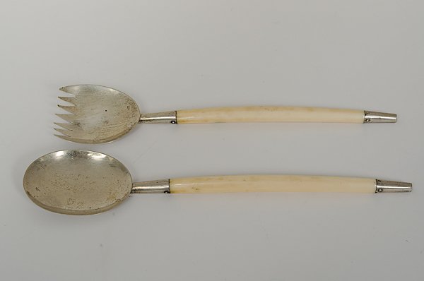Austrian Silver and Ivory Utensils : Austria, ca 1872-1922. A serving spoon and fork with ivory handles and silver ends, with hallmarks for Vienna, Austria and 800 silver, and with maker's mark S.H.; lg. 9.75 in. International shipping i