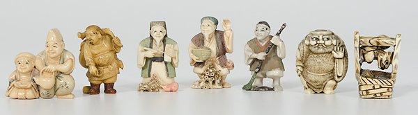 Polychrome Ivory Netsukes, Plus : Japan. An assembled group of seven netsukes including four polychrome figural netsukes with two-character marks, one carved and inked figural netsuke with a two-character mark, one carved and inked ba