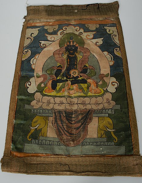 Buddhist Painting : Asia. A painting on fabric of a seated Buddha in dhyanasana on a double lotus leaf atop a pedestal with elephant heads, surrounded by wispy clouds; ht. 24, wd. 15.25 in.