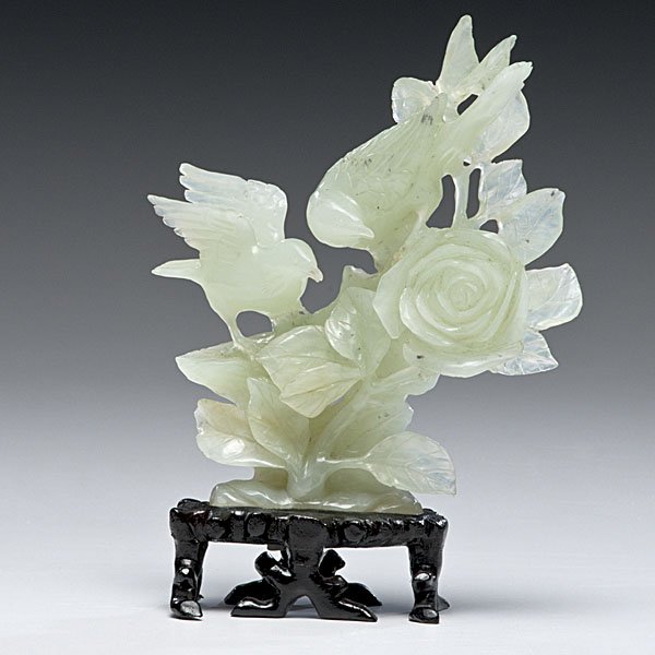 Chinese Bird Carving : China. A bowenite carving depicting two birds on a flowering branch, unmarked, with 20th century wooden stand; ht. 6.5 in.