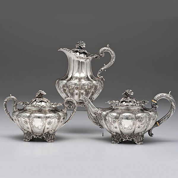 Indian Sterling Partial Tea and Coffee Service: Indian Sterling Partial Tea and Coffee Service Calcutta, India, 1821-1845. A sterling silver tea and coffee set which includes an ornately designed lidded teapot, lidded coffee pot, and lidded two-han