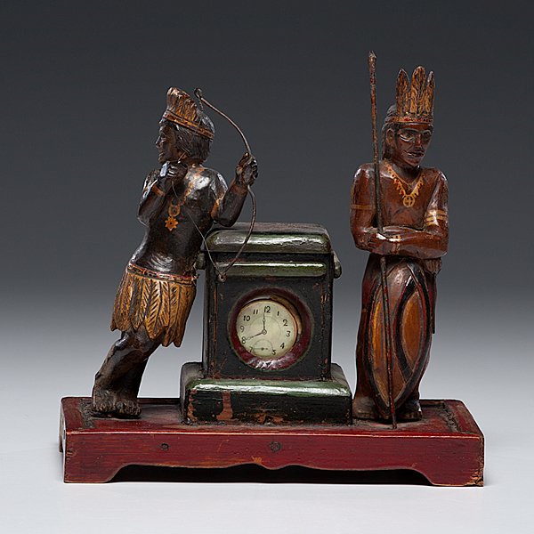 Indian Folk Art Watch Hutch: Indian Folk Art Watch Hutch Likely Continental. A painted and carved wooden folk art watch hutch, having two standing Indian figures flanking the hutch, one holding a bow and the other a spear, the hu