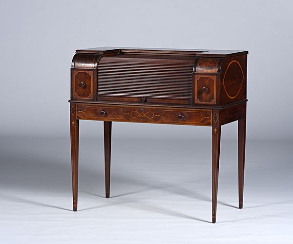 Hepplewhite-style Butler's Bar: Hepplewhite-style Butler's Bar American, 1930. A Hepplewhite-style butler's bar in mahogany having a tambor door opening to a marble top and flanked by bottle drawers, over one long drawer, all rising