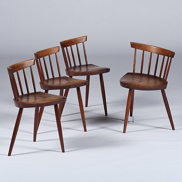 George Nakashima (1905-1990) Mira Chairs: George Nakashima (1905-1990) Mira Chairs American, 20th century. A set of four modernist George Nakashima Mira chairs in walnut. Each chair having a curved back rail over spindles, a triangular seat, 