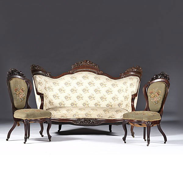 J. H. Belter Rosalie Pattern Parlor Suite: J. H. Belter Rosalie Pattern Parlor Suite New York, ca 1855. A laminated parlor suite in rosewood, attributed to the shop of John Henry Belter (New York, NY, w. 1844-1861). Includes a settee and two s