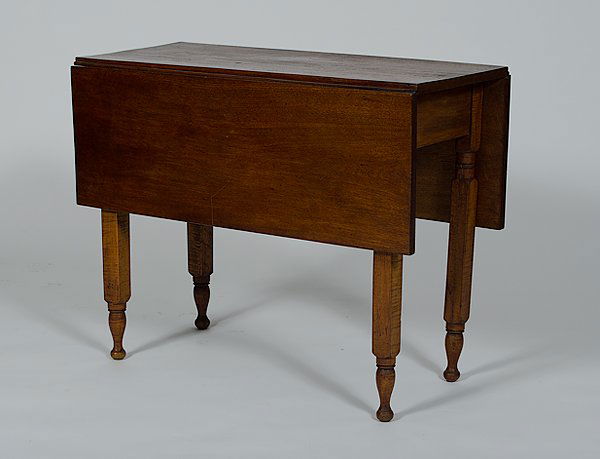Drop Leaf Table : Drop Leaf Table American, a drop leaf table having a walnut top and curly maple block and turned legs; ht. 29, wd. 36.25, dp. 17 in.