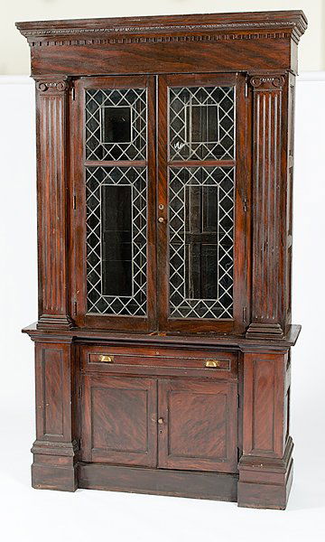 Store Display Case : Store Display Case American, ca 1880s, a classical-style grain-painted store display case in walnut with poplar secondary, having a moulded cornice atop dentil moulding, with two glass doors flanked