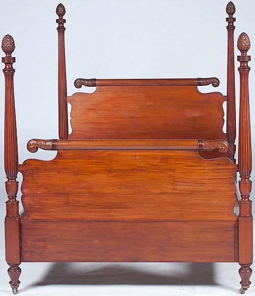 Mahogany Four Post Bed : Mahogany Four Post Bed 20th century, a four post full bed in mahogany having scrolled headboard and footboard with acanthus leaf carving and reeded posts with pineapple finials; ht. 72, wd. 56, lg.