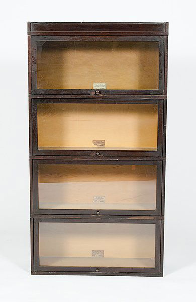 Globe Wernicke Stack Bookcase : Globe Wernicke Stack Bookcase American, 20th century, a four stack barrister's bookcase, each stack with lift-up glass doors, labeled Globe Wernicke Co. / Sectional Bookcase / Cincinnati OH; ht. 63.