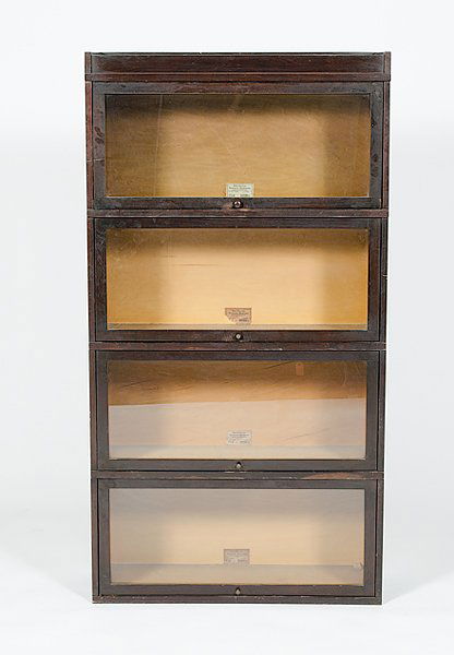 Globe Wernicke Stack Bookcase : Globe Wernicke Stack Bookcase American, 20th century, a four stack barrister's bookcase, each stack with lift-up glass doors, labeled Globe Wernicke Co. / Sectional Bookcase / Cincinnati OH; ht. 63,